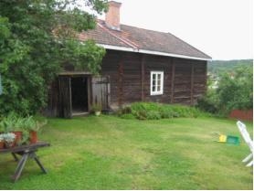 A typical wooden house with a separate barn