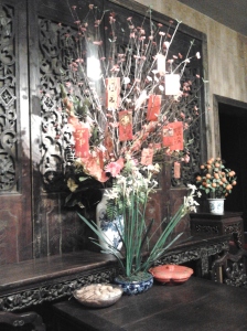 CNY decorations, flowers, candy and red envelopes